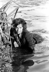 Black and white print of Cyd Hayman in the river during filming