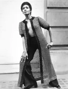 00031 Prints: Fashion 1960s Print: A woman models a long coat and matching suede pants