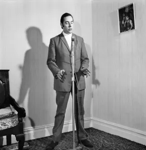00031 Prints: Black and White Print of Man Singing into Microphone