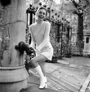 Woman in matching outfit poses at Lincolns Inn Fields, November 1969 Print