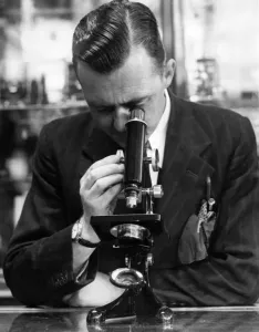 00042 Prints: Print of a Man Examining a Specimen Under Microscope