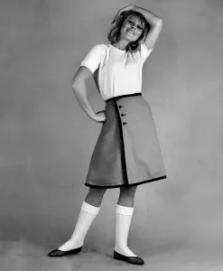 60s Fashion Trends Prints: Reveille Fashions 1965: Marilyn Rickards modeling a white t-shirt and knee length skirt