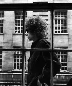 Prints of The one and only Bob Dylan pictured walking past a shop window in London, 3rd May 1966 London Prints: Bob Dylan in London Print, 3rd May 1966 (00086)