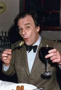 Prints of Keith Floyd Television Chef sampling pub food whilst holding a glass of red wine. June 1991 - - 14/04/2009 Mirror Prints: Keith Floyd Sampling Pub Food Print, June 1991