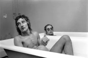 Prints of Singers Elton John and Rod Stewart having bath at Watford football ground. Soccer mad Elton, just back from a tour of America, wants to be a director of Watford F.C Mirror Prints: Elton John and Rod Stewart at Watford Football Ground Print 1973