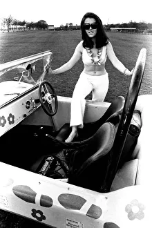 A model in a beach buggy wearing a blouse and trousers in April 1970 A model in a beach buggy wearing a blouse and trousers in April 1970