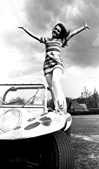 A model in a beach buggy wearing a dress in April 1970 A model in a beach buggy wearing a dress in April 1970