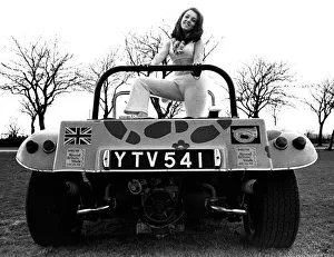 A model in a beach buggy wearing a trouser suit in April 1970 A model in a beach buggy wearing a trouser suit in April 1970