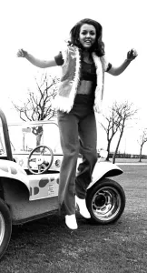 A model in a beach buggy wearing trousers and a fur gillet in April 1970 A model in a beach buggy wearing trousers and a fur gillet in April 1970