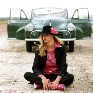 Model poses crossed legged in front of a Morris Minor Tourer. 22nd October 1996 Model poses crossed legged in front of a Morris Minor Tourer. 22nd October 1996