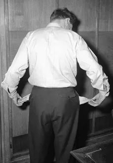 Model poses to illustrate a luck of funds. 29th April 1954 Model poses to illustrate a luck of funds. 29th April 1954