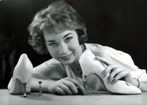 A model showing off a pair of new high heel shoes, which have steel heels that screw A model showing off a pair of new high heel shoes, which have steel heels that screw