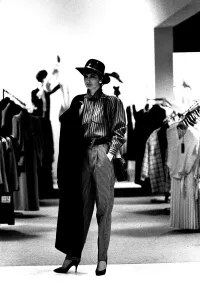 A model wearing some high waisted trousers with a blouse, hat and coat in March 1987 A model wearing some high waisted trousers with a blouse, hat and coat in March 1987