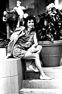 A model wearing a shirt and shorts in March 1987 A model wearing a shirt and shorts in March 1987
