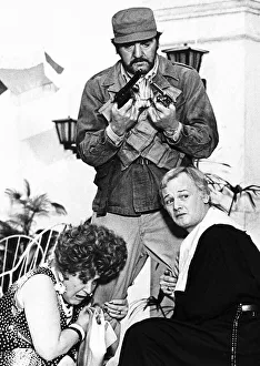 Molly Sugden actress inthe film version of Are You Being Served with John Inman holding Molly Sugden actress inthe film version of Are You Being Served with John Inman holding