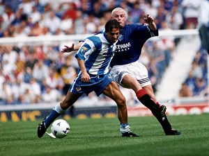 Morton football player Derek McInnes holds off a challenge from Paul Gascoigne of Rangers Morton football player Derek McInnes holds off a challenge from Paul Gascoigne of Rangers