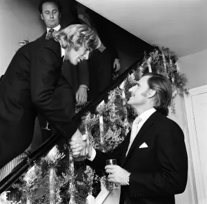 Motor racing driver & groom James Hunt shakes hands with Graham Hill on his wedding day Motor racing driver & groom James Hunt shakes hands with Graham Hill on his wedding day