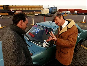 Motors Second Hand a salesman selling a used car to a customer Motors Second Hand a salesman selling a used car to a customer