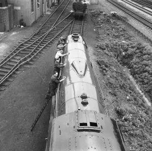 Mr Alan Pegler and his crew of volunteers pictured cleaning The Flying Scotsman Engine Mr Alan Pegler and his crew of volunteers pictured cleaning The Flying Scotsman Engine
