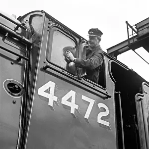 Mr Alan Pegler pictured cleaning The Flying Scotsman Engine window of the drivers cabin Mr Alan Pegler pictured cleaning The Flying Scotsman Engine window of the drivers cabin