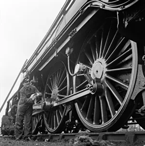 Mr Alan Pegler pictured cleaning the wheels of The Flying Scotsman engine Mr Alan Pegler pictured cleaning the wheels of The Flying Scotsman engine