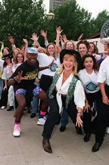 Mr Motivator TV Presenter with Sally Meen GMTV Presenter wearing hat during an outside Mr Motivator TV Presenter with Sally Meen GMTV Presenter wearing hat during an outside