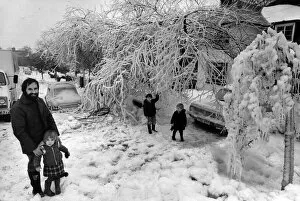 Images Dated 22nd January 1982: Mr Robert Cowley, of Cyncoed in Cardiff, outside his ice covered garden with his children