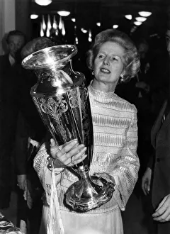 Mrs. Thatcher inspects the Wightman Cup, won earlier this year by Britain' Mrs. Thatcher inspects the Wightman Cup, won earlier this year by Britain'