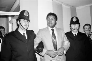 Muhammad Ali under friendly arrest of two London Police officers who were at the training Muhammad Ali under friendly arrest of two London Police officers who were at the training