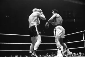 Muhammad Ali lands a punch as Richard Dunn tries to cover up in Munich Muhammad Ali lands a punch as Richard Dunn tries to cover up in Munich