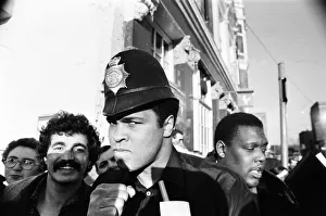 Muhammad Ali seen here on a visit to the UK poses wearing a policemans helmet Muhammad Ali seen here on a visit to the UK poses wearing a policemans helmet