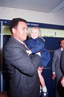 Muhammad Ali seen here with four year old Hannah Clarke during a book signing session at Muhammad Ali seen here with four year old Hannah Clarke during a book signing session at