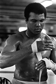 Muhammad Ali wrappings his hands in the gym at his training camp in Deer Lake Muhammad Ali wrappings his hands in the gym at his training camp in Deer Lake