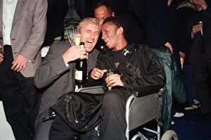 Images Dated 24th February 1997: Musician Tricky, in a wheelchair pictured with another guest at the Brit Music Awards at
