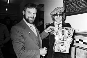 Musician and Watford FC chairman Elton John is presented with a special Jubilee plaque Musician and Watford FC chairman Elton John is presented with a special Jubilee plaque