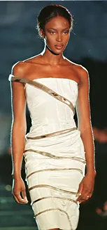 Naomi Campbell modelling white strapless evening dress as part of Donatella Versace' Naomi Campbell modelling white strapless evening dress as part of Donatella Versace'