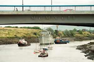 Former Navy Minehunter HMS Kellington being towed underneath the Princess of Wales Bridge Former Navy Minehunter HMS Kellington being towed underneath the Princess of Wales Bridge