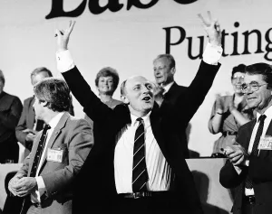 Neil Kinnock Labour Leader politician salutes the cheering delegates at Labours party Neil Kinnock Labour Leader politician salutes the cheering delegates at Labours party