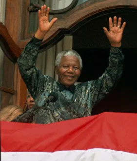 Nelson mandela waves to the crowd in Trafalgar Square during his visit to England Nelson mandela waves to the crowd in Trafalgar Square during his visit to England