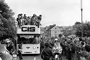 Newport County football team ride through the crowd-lined streets of the town to Newport County football team ride through the crowd-lined streets of the town to