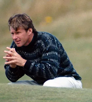 Nick Faldo at the British Open Golf Championship 1995, squats on the 16th green at St Nick Faldo at the British Open Golf Championship 1995, squats on the 16th green at St