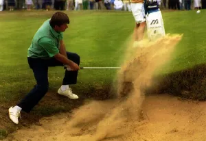 Nick Faldo. golfer chipping out of a bunker Nick Faldo. golfer chipping out of a bunker