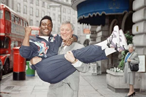 Images Dated 25th June 1991: Nigel Benn gets a lift from manager Barry Hearn ahead of his upcoming fight with Kid Milo