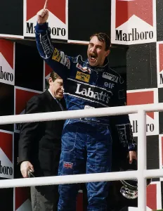 Nigel Mansell Motor Racing Formula One Grand Prix Driver for Williams Renault walks on to Nigel Mansell Motor Racing Formula One Grand Prix Driver for Williams Renault walks on to