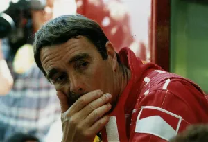 Nigel Mansell Motor Racing Grand Prix Formula One Driver sits with resting his head in Nigel Mansell Motor Racing Grand Prix Formula One Driver sits with resting his head in