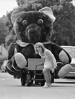 Nineteen year old Elaine Maidment pulls along her giant teddy bear on a trolley through Nineteen year old Elaine Maidment pulls along her giant teddy bear on a trolley through