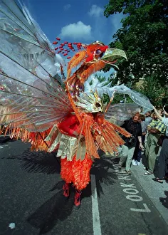 The Notting Hill Carnival Aug 1999 Dancers in the streets of Notting Hill wearing The Notting Hill Carnival Aug 1999 Dancers in the streets of Notting Hill wearing