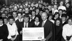 Nunthorpe Comprehensive's head teacher John Rowling is presented with a £10 Nunthorpe Comprehensive's head teacher John Rowling is presented with a £10