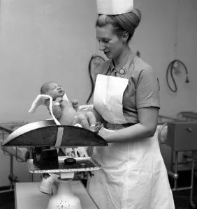 Nurse Anne Stewart with first new born babies of the year at Queen Charlotte' Nurse Anne Stewart with first new born babies of the year at Queen Charlotte'