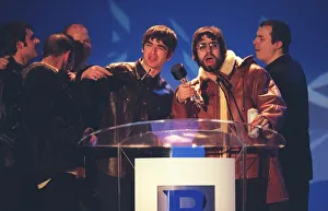 Oasis at the Brit Awards 1996 collecting one of their awards Oasis at the Brit Awards 1996 collecting one of their awards